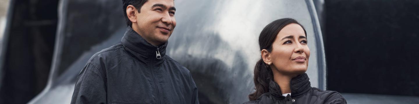 Two AFRY employees photographed in urban environments
