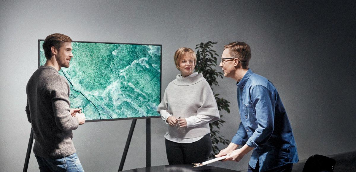 Three people working together