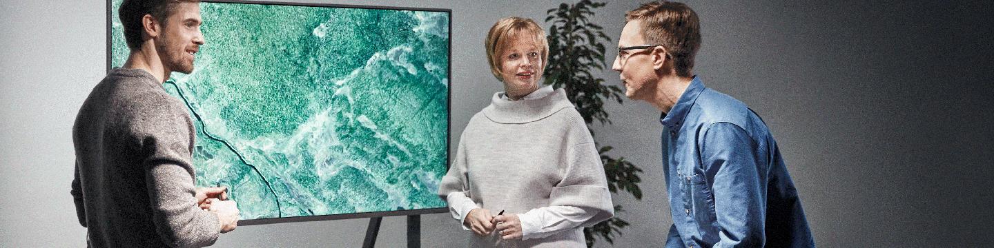 Three people working together