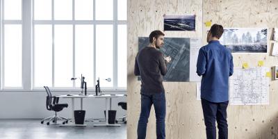 Two men making plans writing ideas on a wall