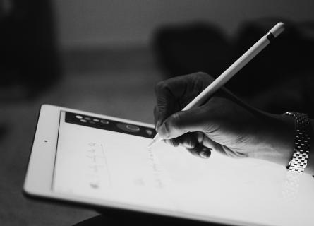 holding and checking ipad tablet