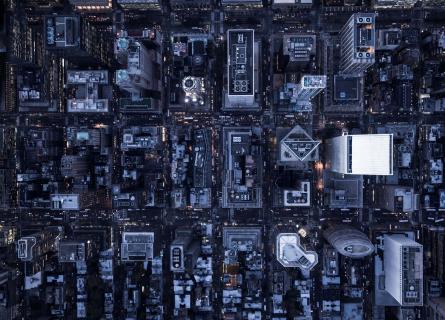 Aerial image of illuminated buildings in Manhattan, New York, between night and day