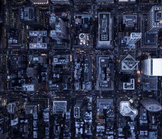 Aerial image of illuminated buildings in Manhattan, New York, between night and day