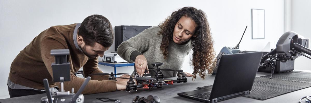 Woman and man working together on product development