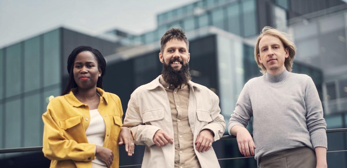 Three AFRY employees photographed outdoors