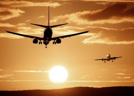 Aircraft in sky setting sun sunset