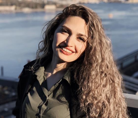 Azadeh standing on a roof in Stockholm.
