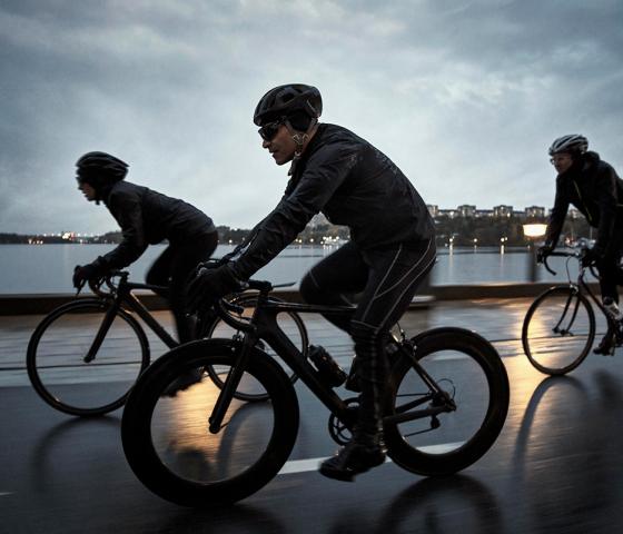 Three people on bicycles