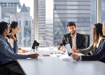 Diverse group of businesspeople discussing double materiality