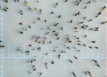 Drone perspective of a group of people connected through digital networks