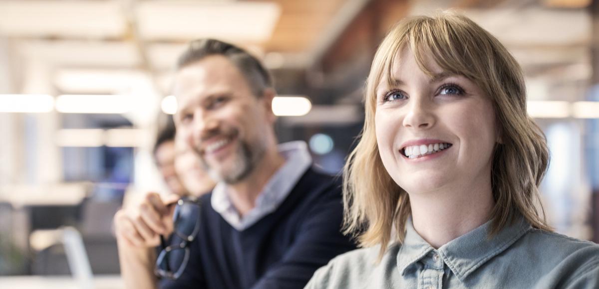 Smartly dressed office workers smiling