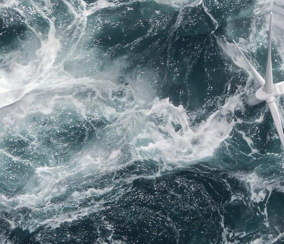 Arial shot of wind turbine at sea
