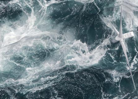 Arial shot of wind turbine at sea