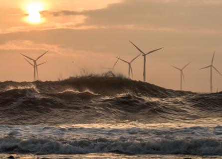 Wind turbines at sunrise off the North East coast of UK