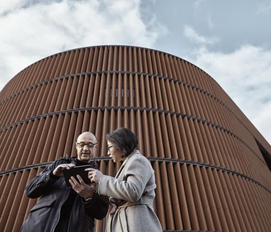 Man and Woman beside power plant in Stockholm