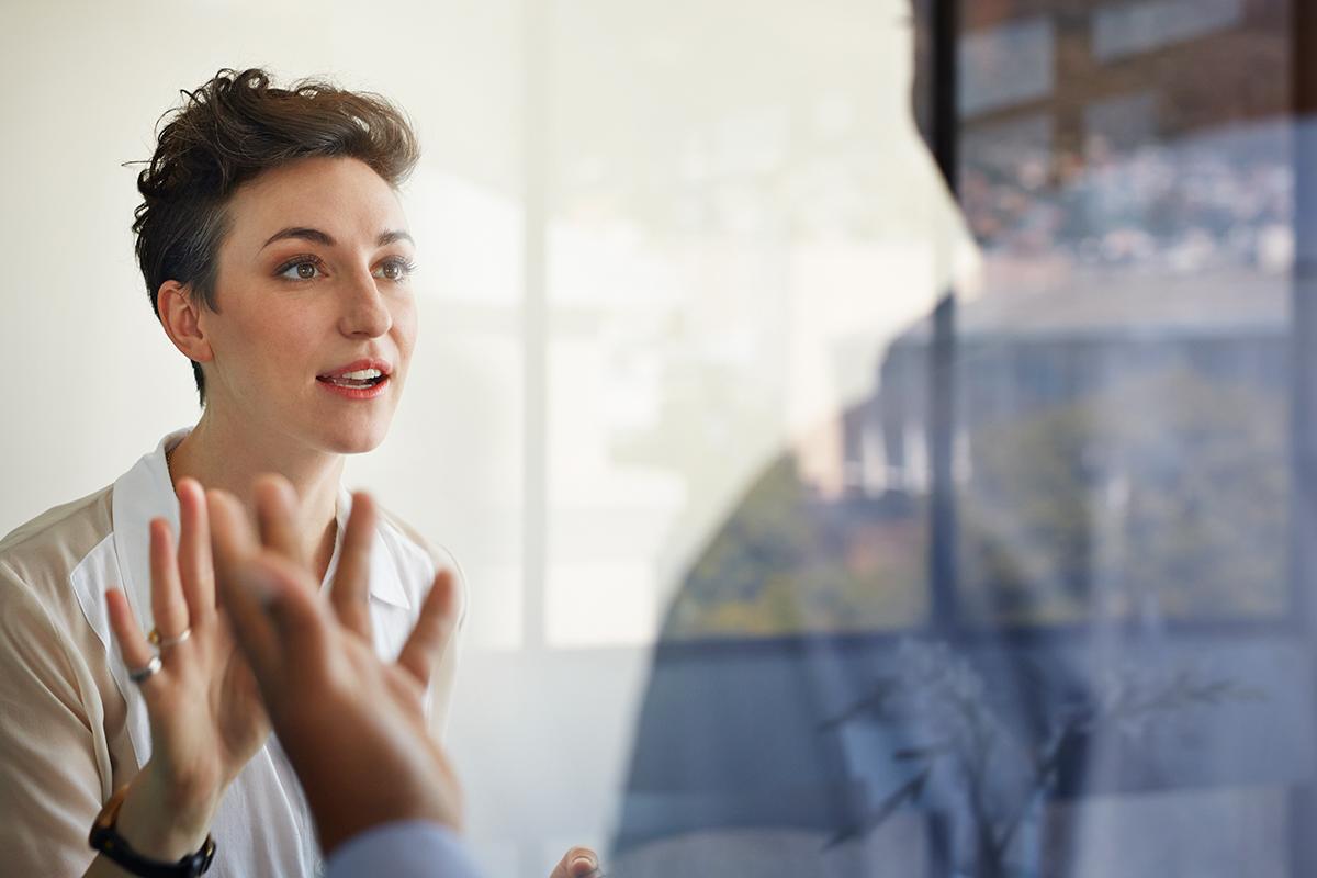 A woman talking to a person 
