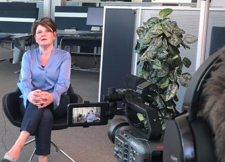 Lotta being interviewed at the office
