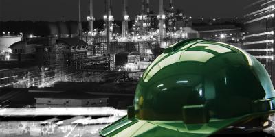 Hard hat on working table in oil refinery plant heavy petrochemical industry estate use for energy,power,fuel,gas and fossil petroleum topic