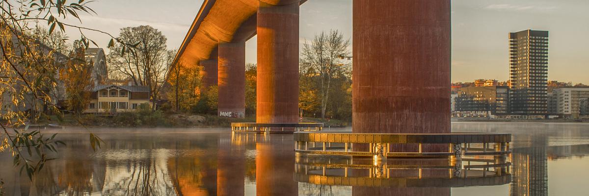 Reflection of a bridge on calm water