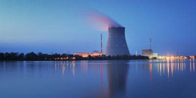 Nuclear power plant on shoreline at dusk