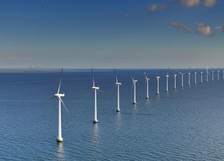 Offshore wind turbines in the blue sea