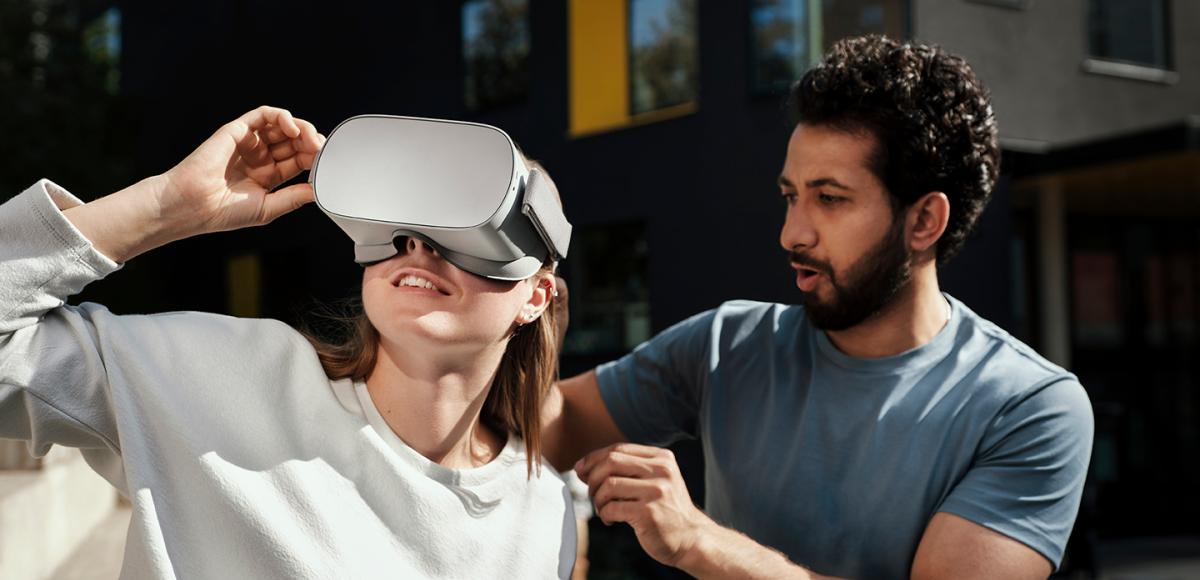 Man and woman trying VR set