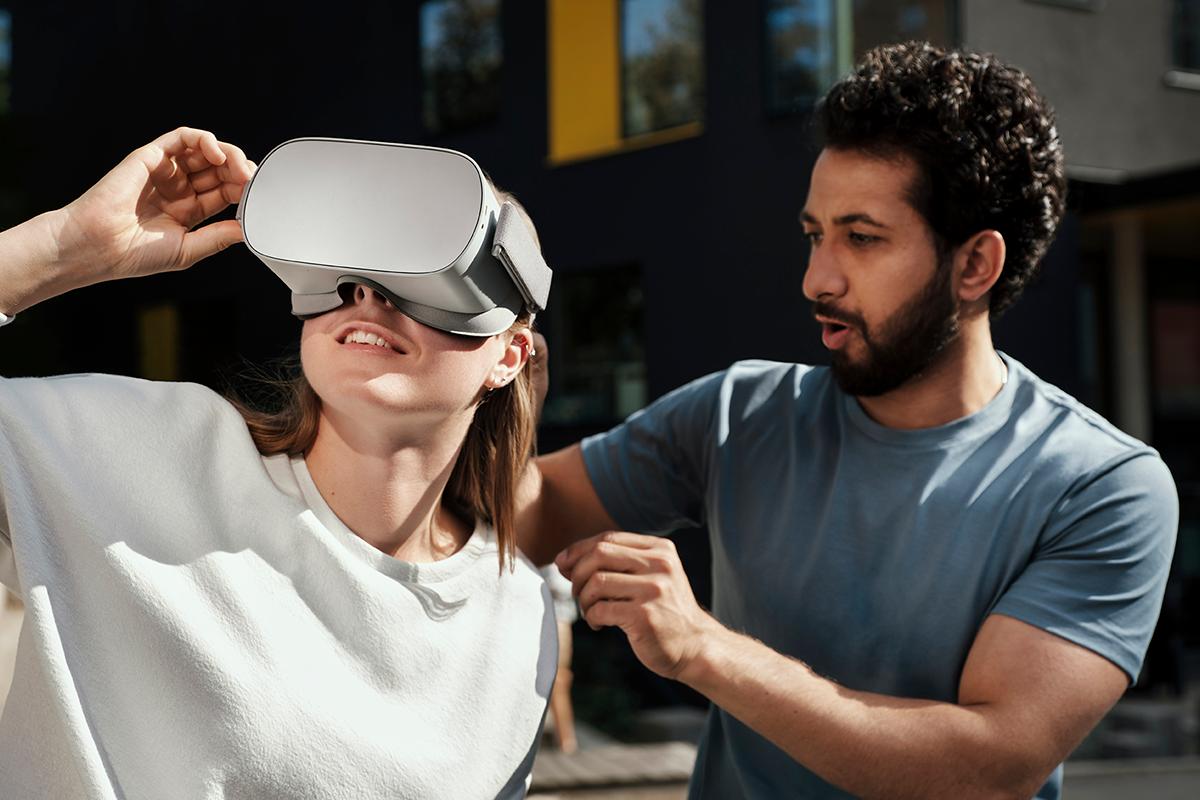 Man and woman trying VR set