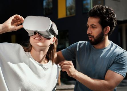 Man and woman trying VR set