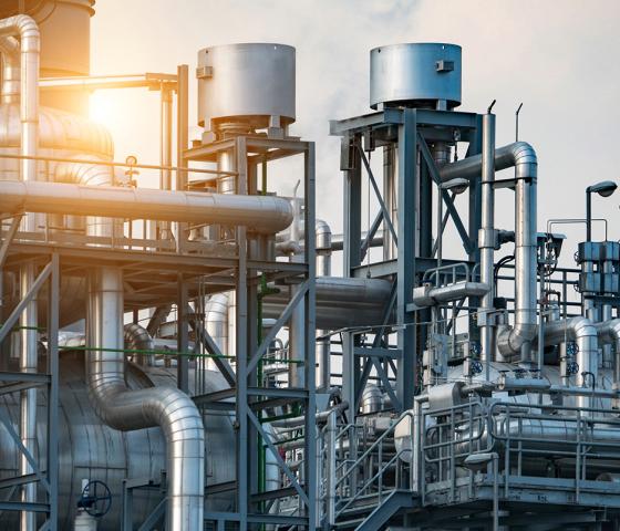 Industrial pipelines with sunset, hero image for process industries