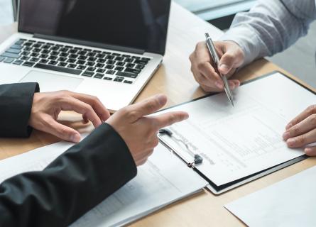 Two persons at a desk