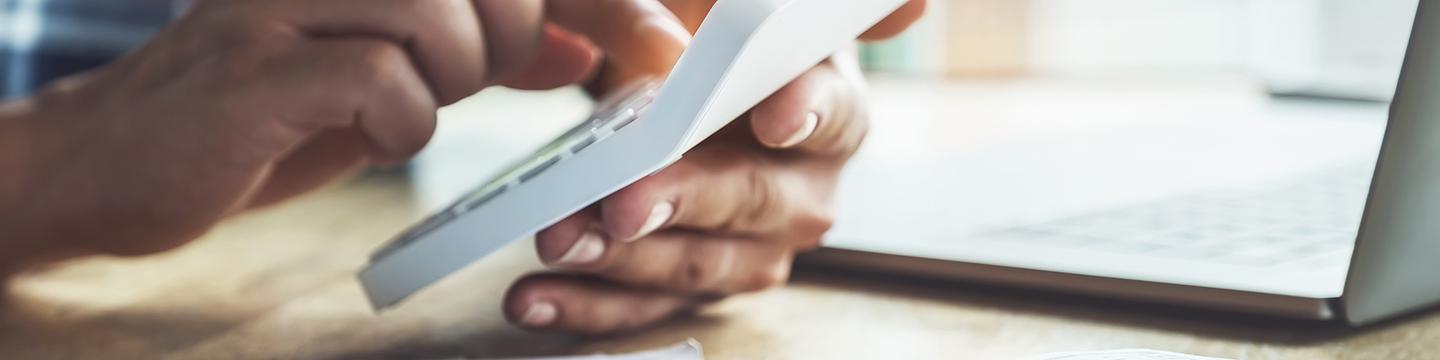 Man using calculator