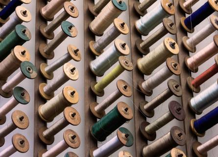 Rows of thread spools in many colours